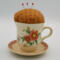 This is the front of the pincushion showing the flowers on the cup as well as the details on the trim of the saucer.